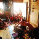 Villagers and curious children look on as researcher Melissa Ilardo takes spleen measurements using a portable ultrasound in a Bajau home.